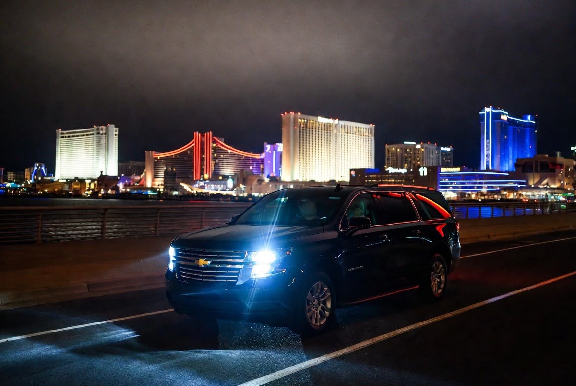 Luxury SUV limo Atlantic City casino strip at night